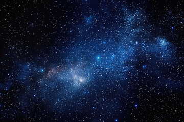 Obraz premium The cosmos teeming with countless stars, forming a dazzling and expansive celestial background.