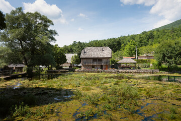 Wonderful Majerovo Vrilo, old mill houses and bridges made from wood and stone in the village of Sinac, Croatia, built around Gacka river source