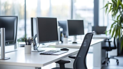 Fototapeta premium fessional office environment with a focus on productivity, featuring individual workstations with modern equipment