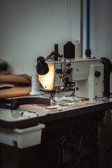 Sewing machine in a corner of classic cars trimming workshop
