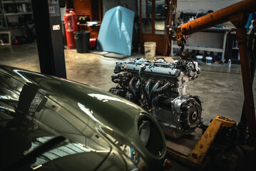 Classic cars being restored in a vintage vehicle garage workshop