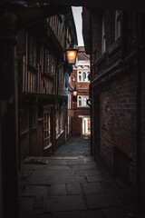 Fototapeta premium Dark, old and narrow alleyway of York, Yorkshire, UK