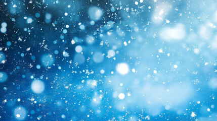Abstract blue background with falling snowflakes and bokeh lights. Christmas or New Year concept
