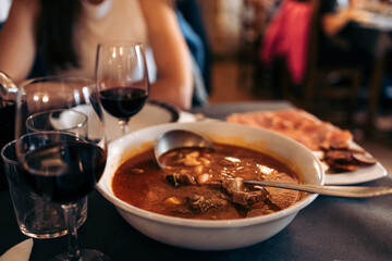 Beef stew and wine in rural restaurant.