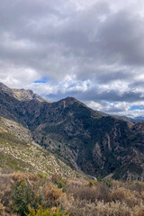 Naklejka premium Panoramic view from hiking trail to Maroma peak in thunderstorm day, Sierra Tejeda, Spain 