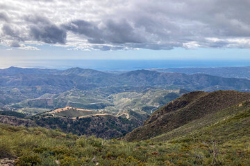 Fototapeta premium Panoramic view from hiking trail to Maroma peak in thunderstorm day, Sierra Tejeda, Spain 