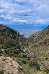 Panoramic view from hiking trail to Maroma peak in thunderstorm day, Sierra Tejeda, Spain 