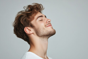 Obraz premium A close up of a man's face with his eyes closed