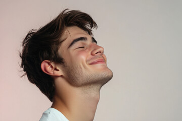 Fototapeta premium A close up of a man's face with his eyes closed