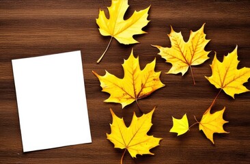Blank sheet of paper on wooden table, top view next to yellow autumn maple leaf. Mockup, empty space, place for text.