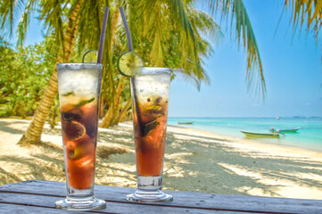 Two drinks with decoration on a tropical beach