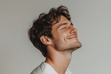 Obraz premium A close up of a man's face with his eyes closed