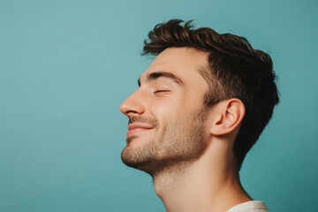A close up of a man's face with his eyes closed