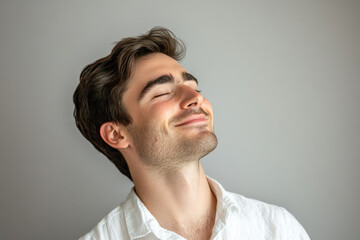 Fototapeta premium A close up of a man's face with his eyes closed