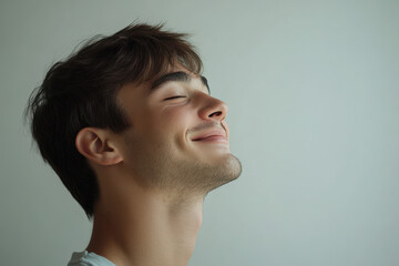 Fototapeta premium A close up of a man's face with his eyes closed