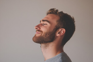 Fototapeta premium A close up of a man's face with his eyes closed