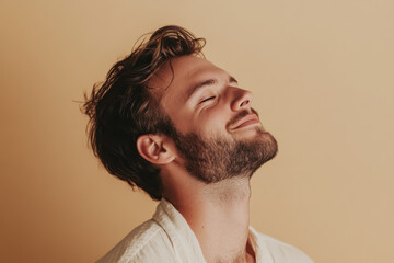 Obraz premium A close up of a man's face with his eyes closed