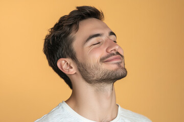 Obraz premium A close up of a man's face with his eyes closed