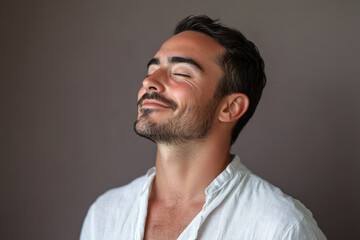A close up of a man's face with his eyes closed