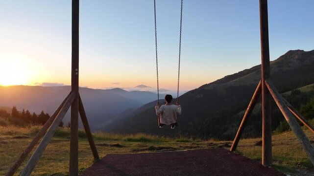 Swinging on a Swing at Sunset Drone Video, K&uuml;mbet Plateau Black Sea  Giresun, Turkiye (Turkey)