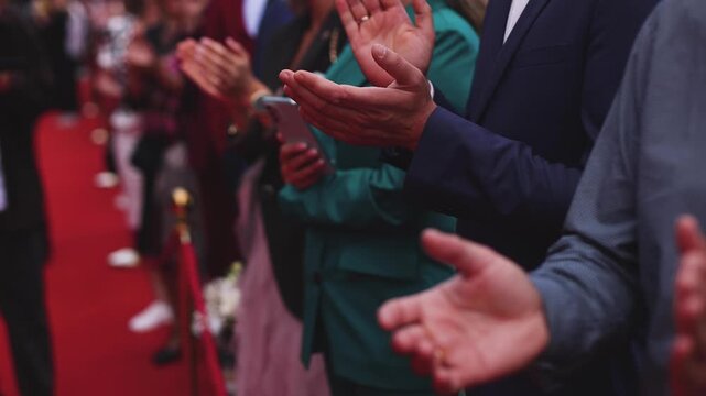 Red carpet with ropes and golden barriers on a luxury party entrance, cinema premiere film festival event award gala ceremony, wealthy rich guests arriving, outdoor decoration elements, summer day