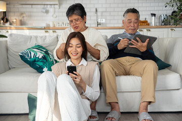Asian daughter shared a moment of joy with her parent, engaging in a lively conversation that brought laughter and smiles. They embraced in a warm hug, cherishing the special bond between them