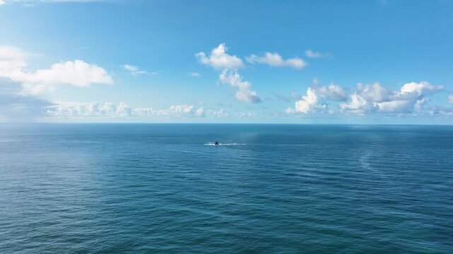 A lighthouse rising out of the ocean. Fastnet lighthouse