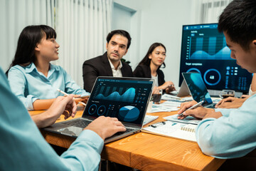 Financial data analysis dashboard by Fintech BI or business intelligence display on laptop screen to in-depth financial data analysis by business people working on business marketing. Habiliment