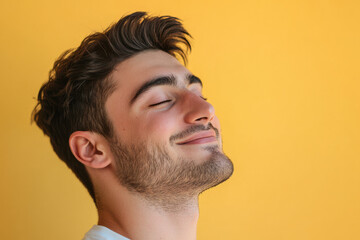 Obraz premium A close up of a man's face with his eyes closed