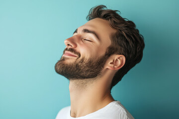 Fototapeta premium A close up of a man's face with his eyes closed