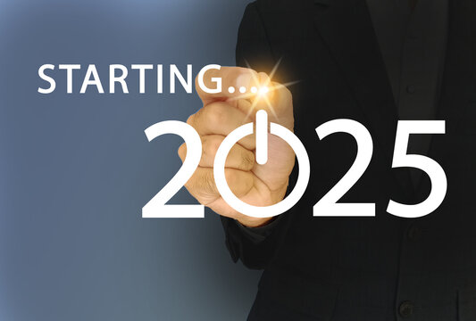 Businessman touching the screen having text starting 2025 and start button icon