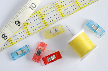 Yellow Sewing Kit with Ruler on White Background