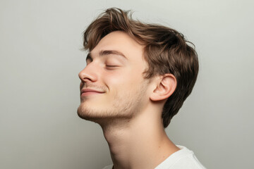 Obraz premium A close up of a man's face with his eyes closed