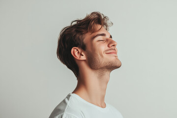 Obraz premium A close up of a man's face with his eyes closed