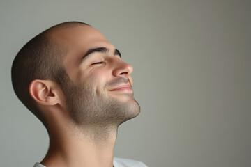 Fototapeta premium A close up of a man's face with his eyes closed