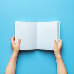 Open Book Held by Hands on Blue Background