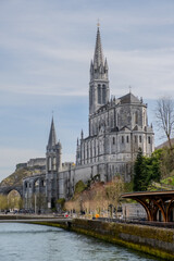 Lourdes Cathedral's Majestic Towers and Gothic Design