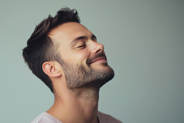 Fototapeta premium A close up of a man's face with his eyes closed
