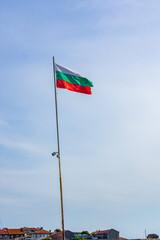Bulgarian national flag waving in a blue sky