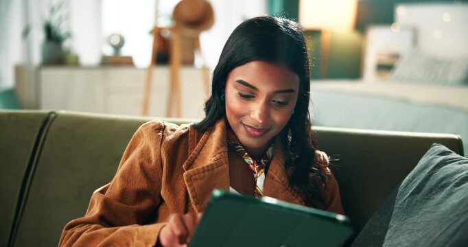 Tablet, relax and woman on sofa in home planning holiday trip with hotel booking app online. Smile, digital technology and female person with research for vacation resort or activities in apartment.