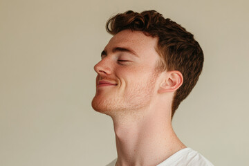 Fototapeta premium A close up of a man's face with her eyes closed