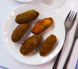 Traditional Spanish cuisine - croquetas caseras, fritters with ham