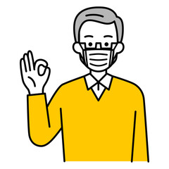 Obraz premium マスクを付けてOKサインをする年配の男性