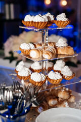 Dessert stand filled with pastries and sweets, perfect for a festive occasion or celebration.