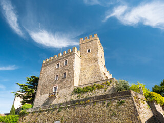 Medieval Manciano Castle: Tuscan Fortress Towering Against Azure Summer Sky