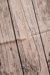 Close-up of a rustic wooden surface with natural textures and grain, ideal for backgrounds or design projects.