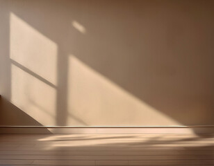 Beige blank wall interior background, with shadow from window. Background concept studio and...