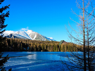 Fototapeta premium The beautiful surroundings of Štrbské pleso lake and a view of the High Tatras mountains in Slovakia.