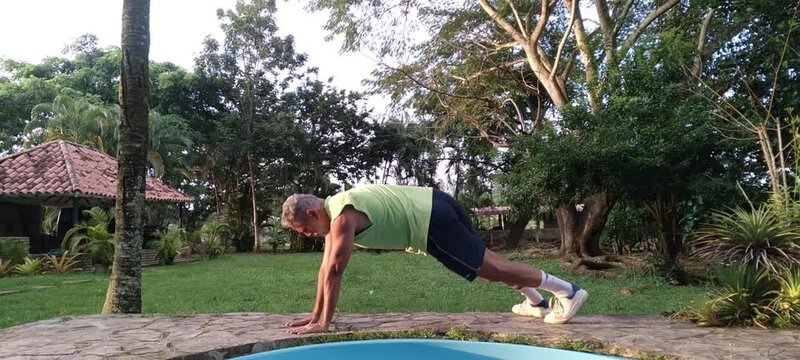 50 year old man doing basic calisthenics exercises