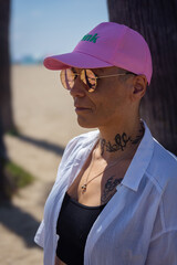 Woman with cancer enjoying a sunny day at the beach